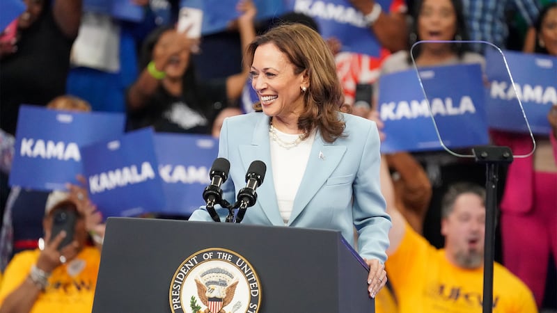 Kamala Harris stands at a podium