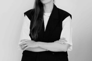 Sofie Dolva, director of Copenhagen International Fashion Fair (CIFF), stands before a white backdrop.