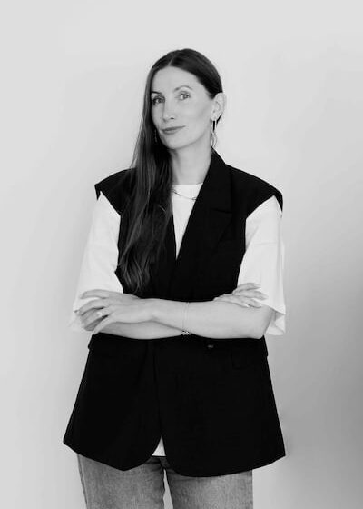 Sofie Dolva, director of Copenhagen International Fashion Fair (CIFF), stands before a white backdrop.