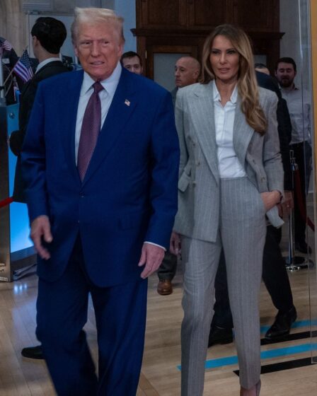 President-elect Donald Trump walks onto the floor of the New York Stock Exchange with his wife Melania.