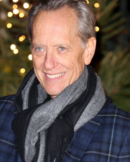 Image may contain Richard E. Grant Face Head Person Photography Portrait Adult Happy Smile Clothing and Scarf