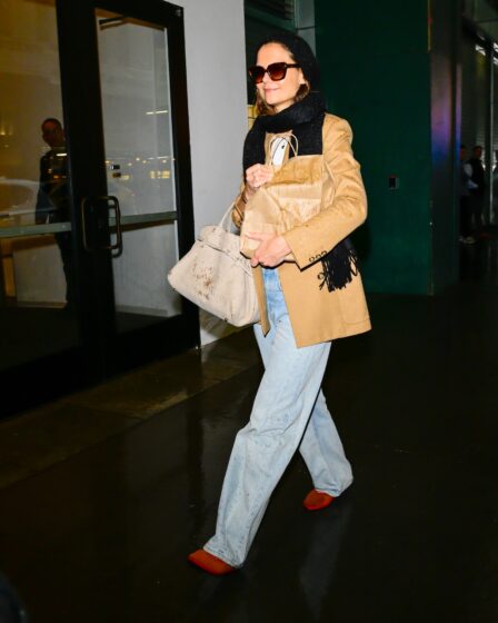 Image may contain Katie Holmes Clothing Pants Coat Accessories Bag Handbag Adult Person Footwear Shoe and Glasses