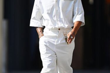 Lewis Hamilton of Great Britain and Mercedes walks in the Paddock during previews ahead of the F1 Grand Prix of Abu Dhabi