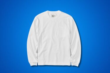 long-sleeve white t-shirt set against a blue background