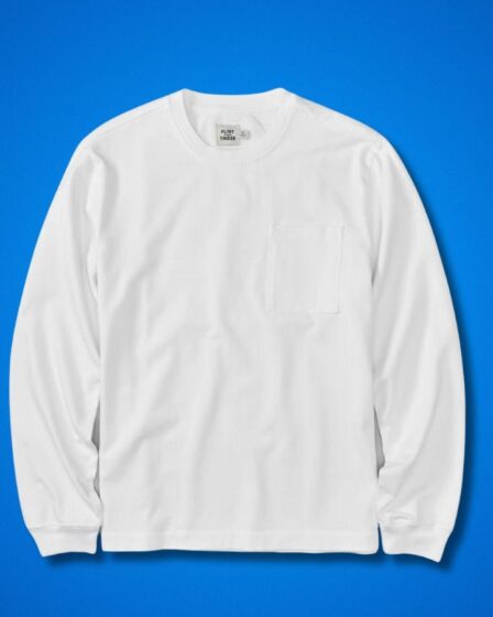 long-sleeve white t-shirt set against a blue background