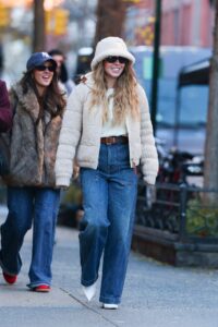 Image may contain Sydney Sweeney Ilenia Lazzarin Clothing Pants Jeans Hat Accessories Glasses Belt and Footwear