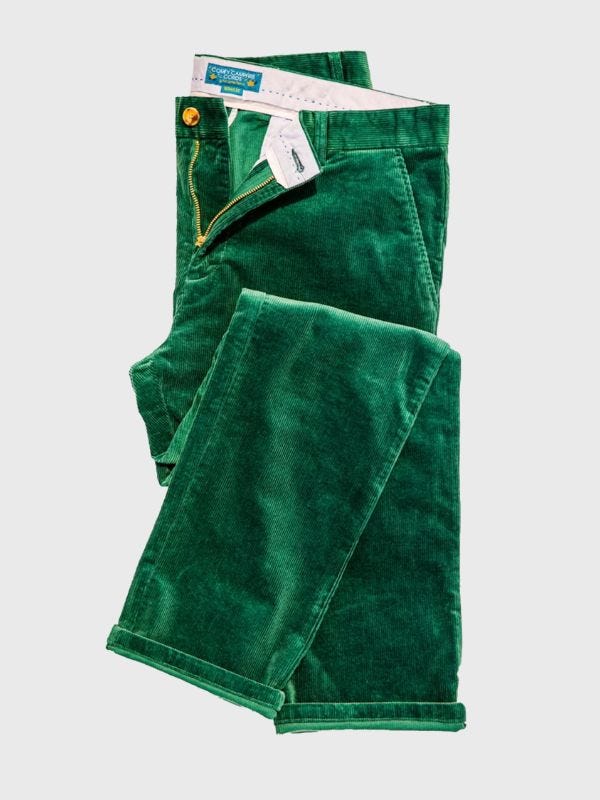 folded pair of green corduroy pants