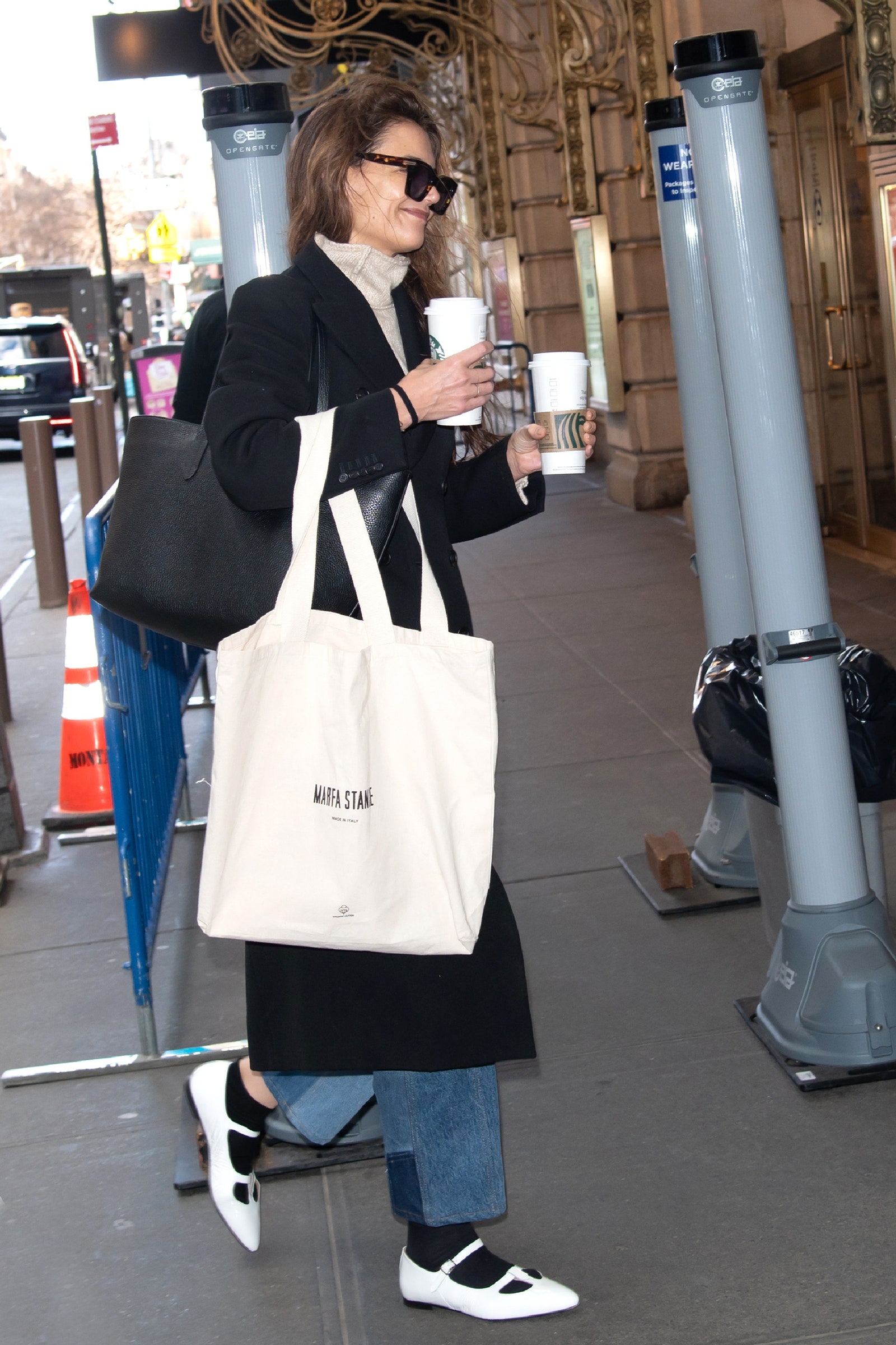 Image may contain Katie Holmes Accessories Glasses Clothing Footwear Shoe Bag Handbag Face Head Person and Adult