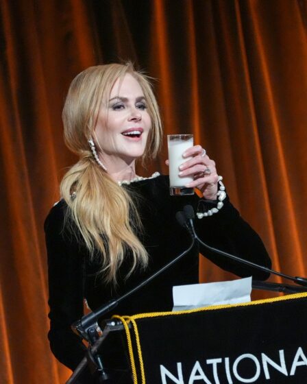 Image may contain Nicole Kidman Crowd Person Adult Audience Electrical Device Microphone Beverage Milk and Speech