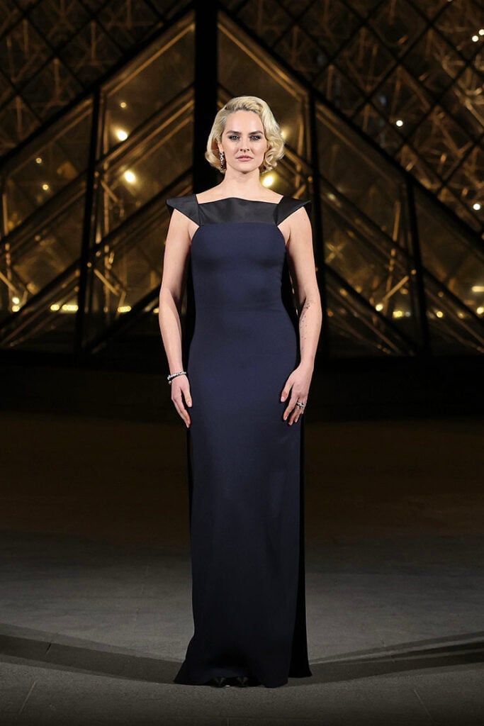 Noémie Merlant attends the "Le Grand Diner du Louvre" Arrivals Photocall