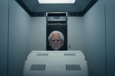Image may contain Indoors Adult Person Elevator Computer Hardware Electronics Hardware Monitor and Screen