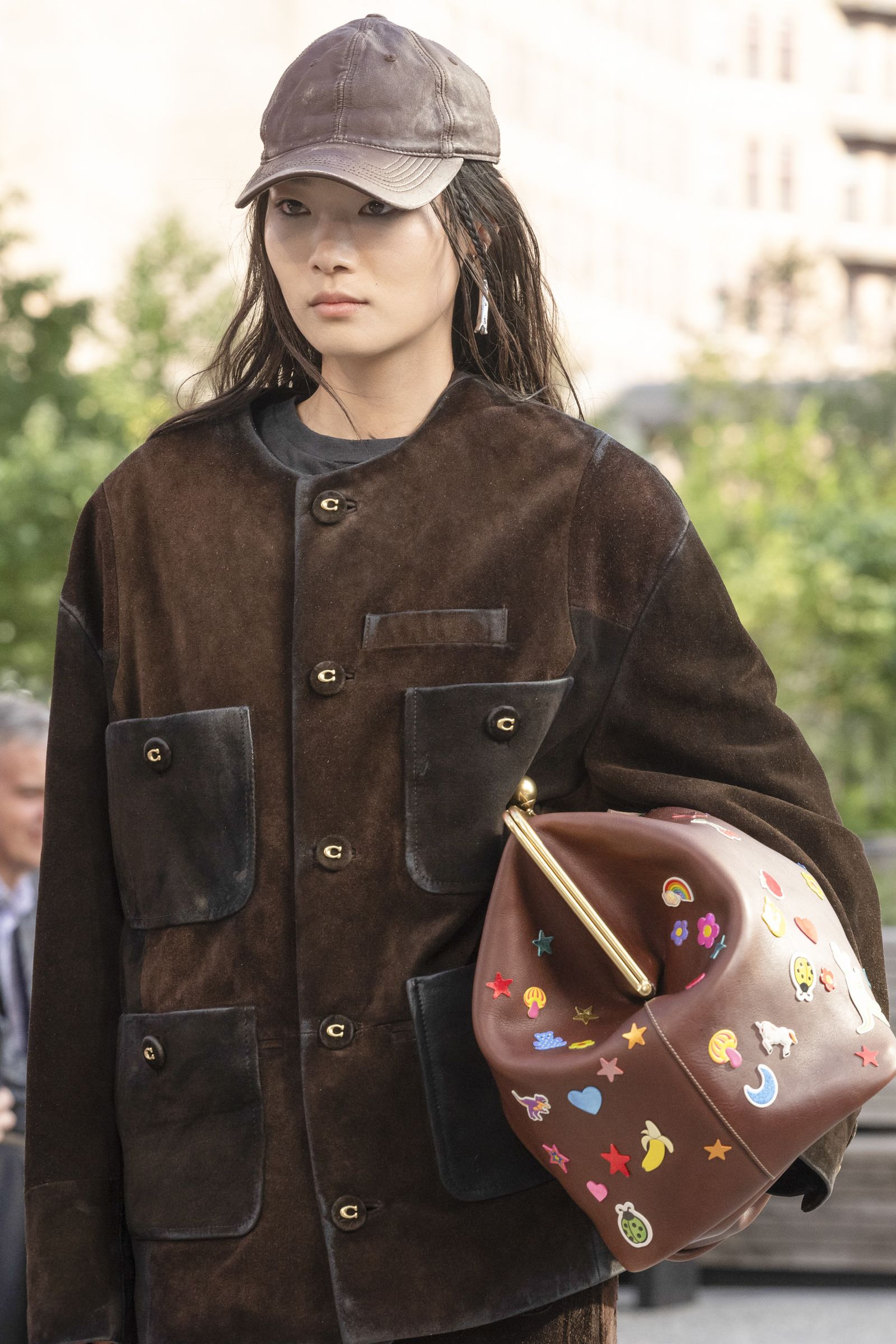 Image may contain Rachel Lee Priday Accessories Bag Handbag Clothing Coat Purse Jacket Baseball Cap Cap and Hat