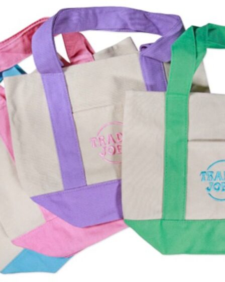 Mini canvas tote bags in pastel blue, pink, purple and green available at Trader Joe's