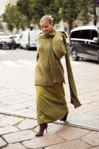Image may contain Clothing Knitwear Sweater Footwear High Heel Shoe Car Transportation Vehicle Adult and Person