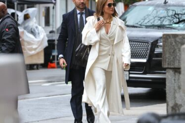 Image may contain Brett Goldstein Jennifer Lopez Pedestrian Person Adult Accessories Bag Handbag Clothing and Coat