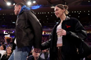 Image may contain Andrew Patrick Ralston Pete Davidson Lola Doillon Clothing Coat Jacket Adult Person and Cup