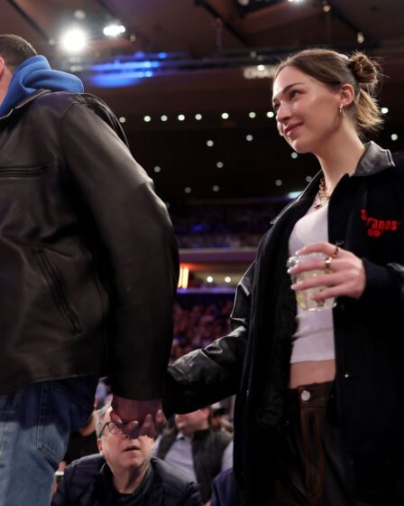 Image may contain Andrew Patrick Ralston Pete Davidson Lola Doillon Clothing Coat Jacket Adult Person and Cup