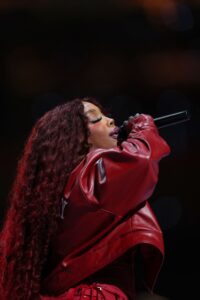 Image may contain SZA Performer Person Solo Performance Adult Accessories Bag Handbag Leisure Activities and Music