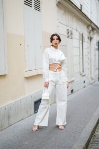 PARIS FRANCE  APRIL 28 Ketevan Giorgadze katie.one wears a cropped tie waist shirt from Le Ger mid rise wide leg ripped...