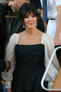 Image may contain Kris Jenner Face Happy Head Person Smile Black Hair Hair Clothing Dress Adult and Wedding